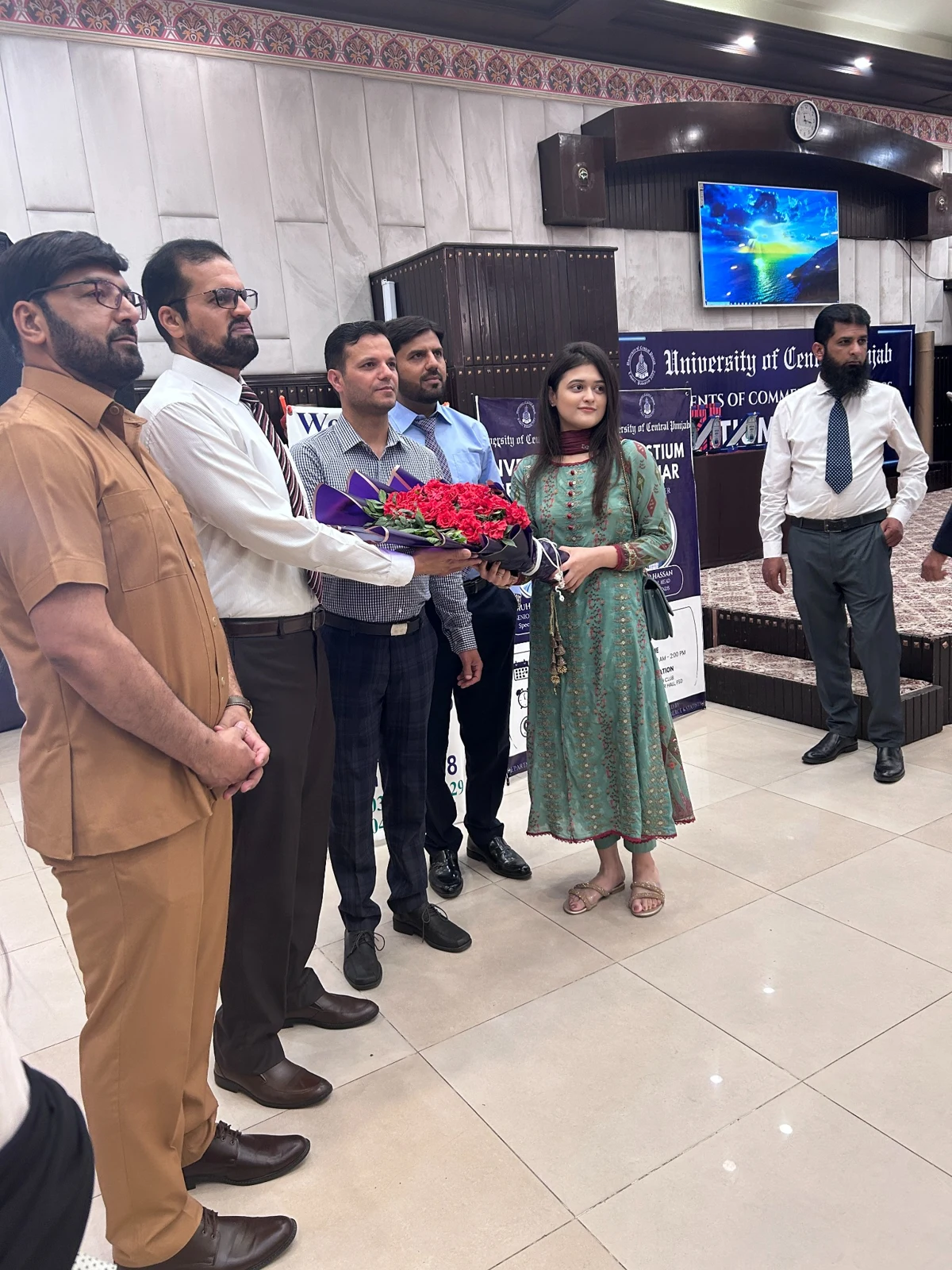 Bouquet presentation at the University of Central Punjab event